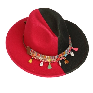 Detail of red and black felt fedora with bohemian braided band and shell charms