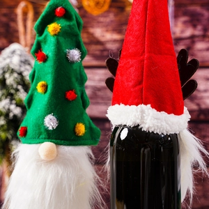 Detail view of festive gnome wine bottle toppers with Christmas tree and reindeer designs