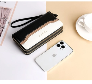 Dual zipper long wallet size comparison with smartphone and elegant lifestyle props
