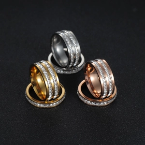 Detail view of double row square zircon rings in gold silver and rose gold finishes