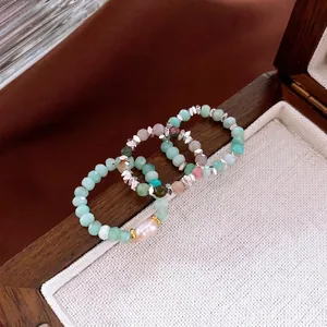 Vintage style beaded rings set with Amazonite stones and a Baroque pearl in a wooden box