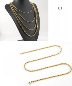 Detail of 18K gold plated stainless steel square pearl chain necklace shown on display stand