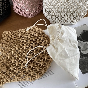 Handmade woven bucket bag with cotton drawstring liner in beige white and black