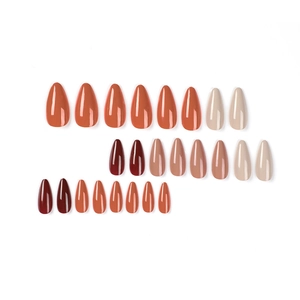 24pcs almond press-on nails in glossy red, beige and burgundy tones on white background