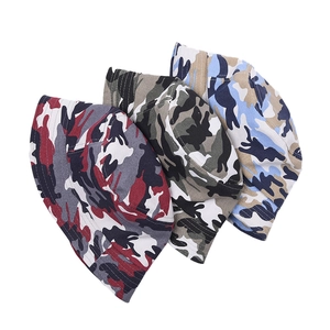 Three camouflage bucket hats for kids in red, green and blue patterns on white background