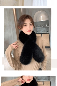 Detail of black faux fox fur scarf with a criss-cross design for winter warmth