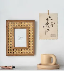 Detail of 5x7 inch natural rattan picture frame with solid wood border in home setting
