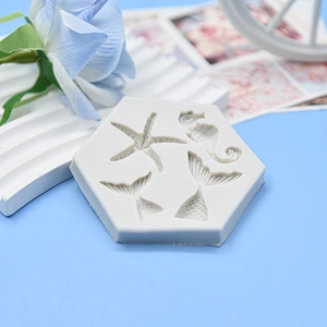 Hexagonal silicone mold with detailed starfish, seahorse and mermaid tail patterns