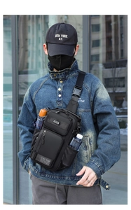 Detailed view of black nylon crossbody chest bag with functional zipper pockets on model