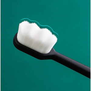 Close-up of high-density ultra-soft nano bristles with wave-cut shape and black handle