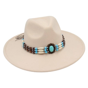 Detail of white wool fedora hat featuring ethnic beaded band and turquoise stone accent