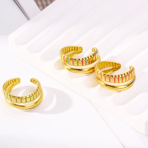 Detail of 18K gold plated striped ring with colorful enamel inlay in triple colors