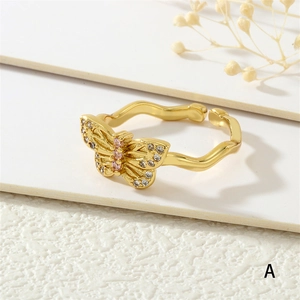 Close-up of butterfly ring with zircon inlay and 18K gold plated texture details