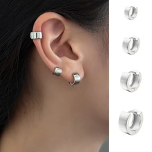 Detailed comparison of silver hollow bow huggie hoops and ear cuffs in multiple sizes