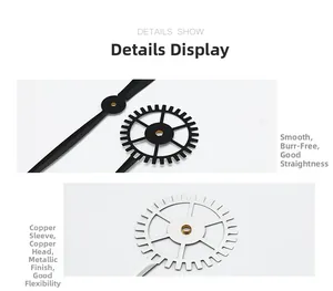 Close-up of black and silver metal clock hands with precise copper sleeve center