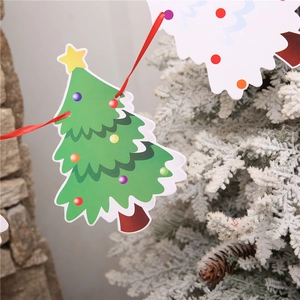 Detail of Christmas tree paper banners with colorful ornaments on a festive red ribbon