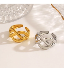 Detailed view of intertwined 18K gold and silver plated crossover adjustable rings