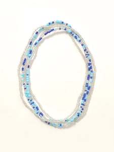 Detail of bohemian multilayered waist chain with clear and blue glass seed beads