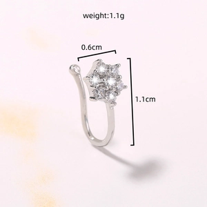Detail shot of silver star nose cuff with cubic zirconia and size dimensions labels