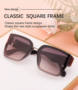 Close-up of classic square frame sunglasses with gradient tea lenses and metal details
