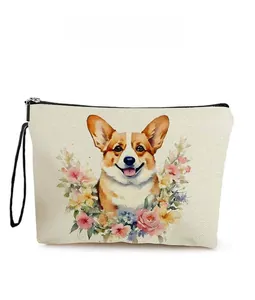 Detail showing corgi dog watercolor print and floral patterns on canvas makeup bag