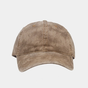 Close-up of vintage brown washed denim fabric texture on high quality baseball cap