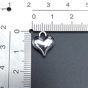 Detailed scale measurement showing the 1.3cm width of silver vintage alloy heart pendant