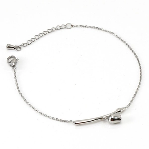Detailed view of silver tulip bud pendant on a sleek adjustable metal chain bracelet