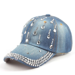 Detail of washed blue denim baseball cap with sparkling teardrop rhinestones