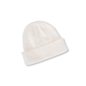 Detailed close-up of a white ribbed knit beanie featuring a classic wide cuff design