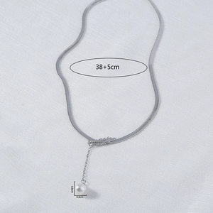 Silver leaf fringe necklace with a white pearl pendant on a flat snake bone chain