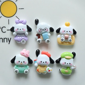 Close-up of assorted resin Pochacco dog charms for DIY crafts and accessories