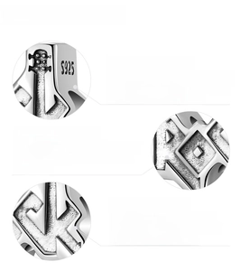 Detailed view of 925 sterling silver bead showcasing polishing and engraving process
