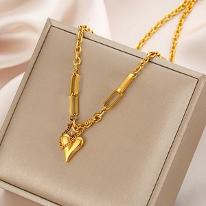 Retro hip-hop gold heart pendant necklace in layered stainless steel on silk