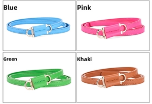 Detail view of thin women's PU leather belts in blue, rose red, green, and khaki with gold buckles