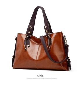 Genuine leather shoulder bag women large capacity contrast color casual handbag commuting.