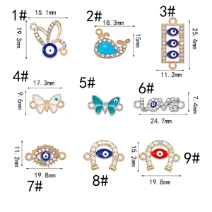Detailed size chart of Evil Eye and heart charms with crystal rhinestones and enamel