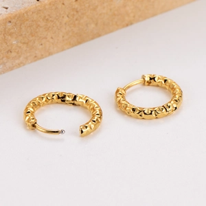 Polished gold stainless steel hoop earrings with geometric hammered texture on stone base