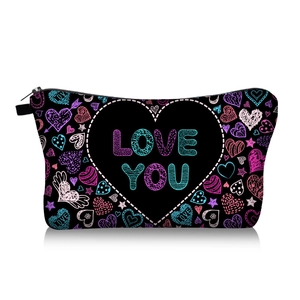 Macro detail of black heart print cosmetic bag with Love You text and zipper closure