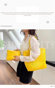 Detail of yellow mesh tote bag set with matching zipper pouch in natural sunlight