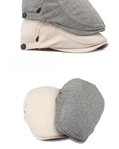 Detailansicht von Baumwoll-Leinen-Baskenmützen in Grau-Fischgrät- und Beige-Twill-Muster