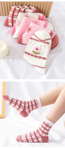 Detailed knit texture of pink floral cotton mid-calf socks with wavy lace edges