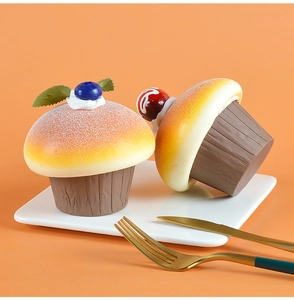 Realistic PU artificial cupcakes with blueberries and cherries on a warm orange backdrop
