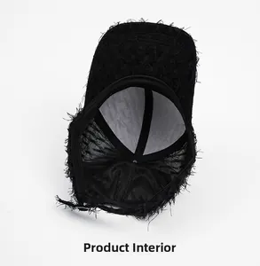 Internal structure of distressed black baseball cap showing mesh lining and stitching