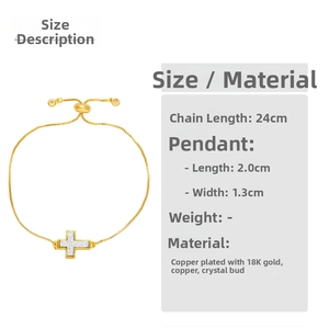 Detail of 18K gold-plated cross bracelet showing adjustable box chain and druzy stone charm