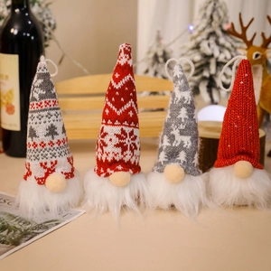 Set of four plush Christmas gnomes with knitted hats and warm glowing LED lights