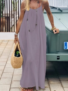 Detail of a purple backless long summer dress featuring a thin strap and V-neckline