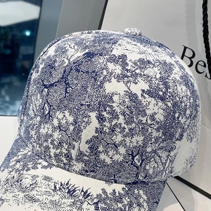 Classic blue and white baseball cap with Toile de Jouy print and stylish sun visor