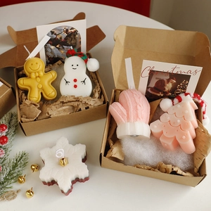 Detailed top view of Christmas candles shaped like snowman, gingerbread man and tree