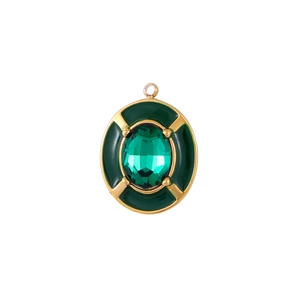 Vintage oval pendant with emerald green zircon and dark green enamel in gold frame